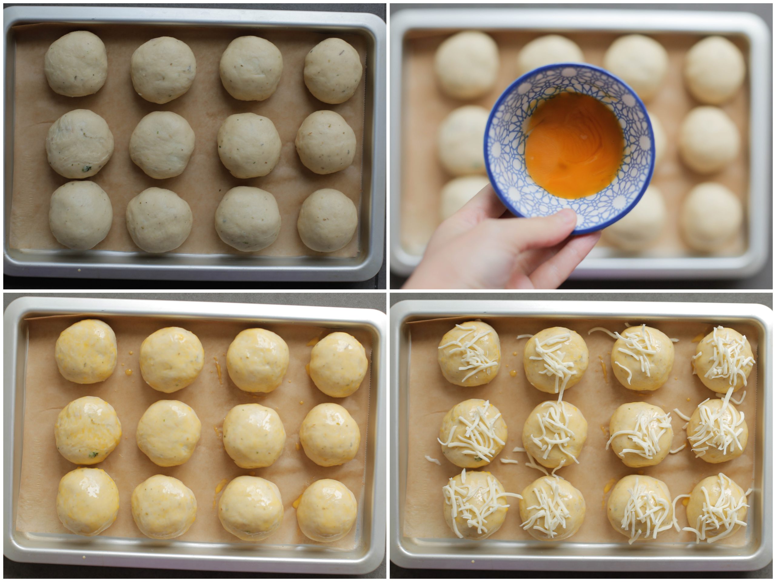 Spinazie-kaasbollen garneren met eigeel en gerapste kaas voordat ze de oven in gaan