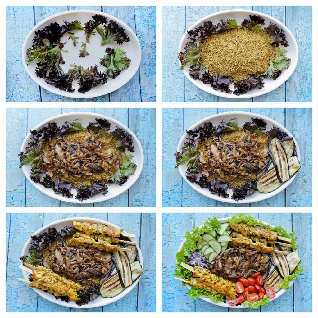 Neem een groot bord en verdeel er wat sla over. Schep de bulgur in het midden en verdeel er de gekarameliseerde ui over. Voeg de aubergine, kipspiesjes, komkommer, gele ui en snoeptomaatjes toe langs de zijkanten.