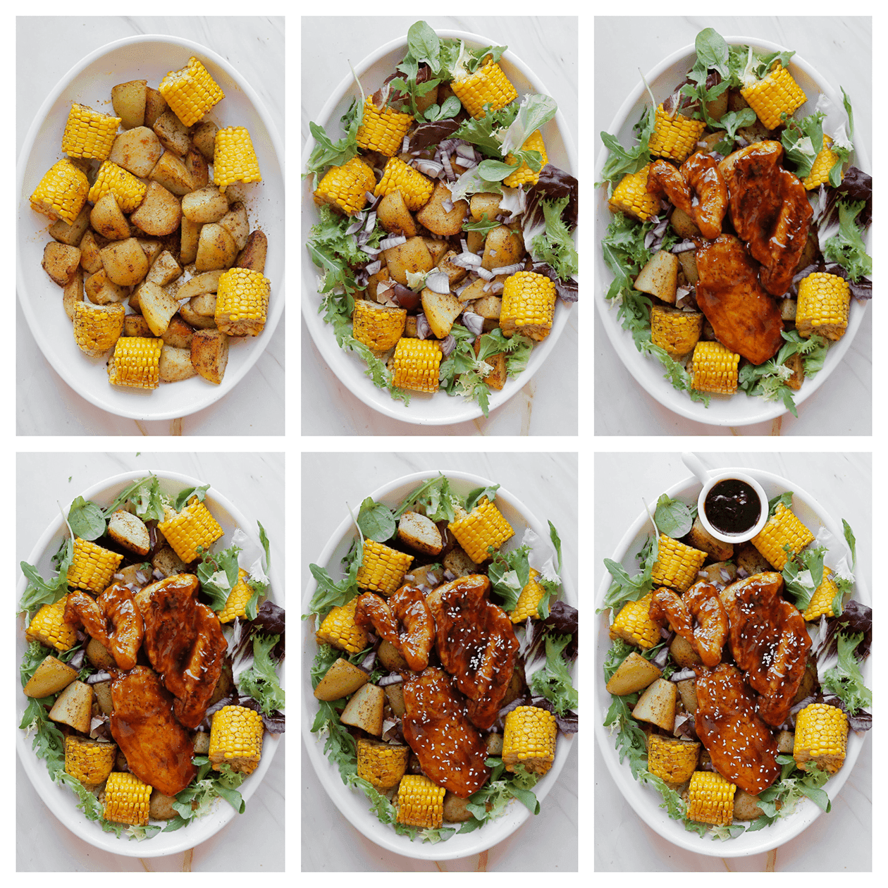 Aardappels, maiskolven, sla en kip verdelen over een bord