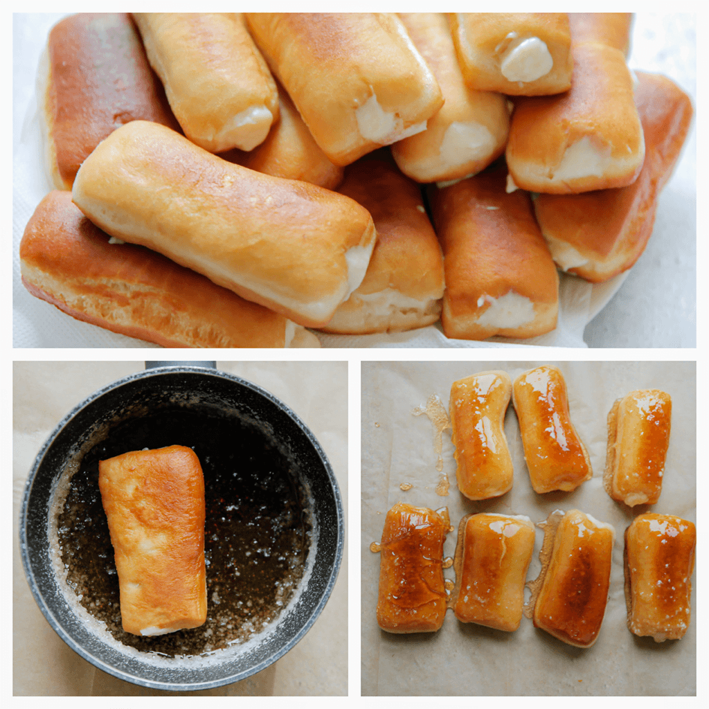 Dep de bovenkant van de donut door het suikerglazuur. Het is belangrijk om de donuts direct door het warme glazuur te halen. Doe dit snel, want als het suikerglazuur koud is, lukt dit niet meer.