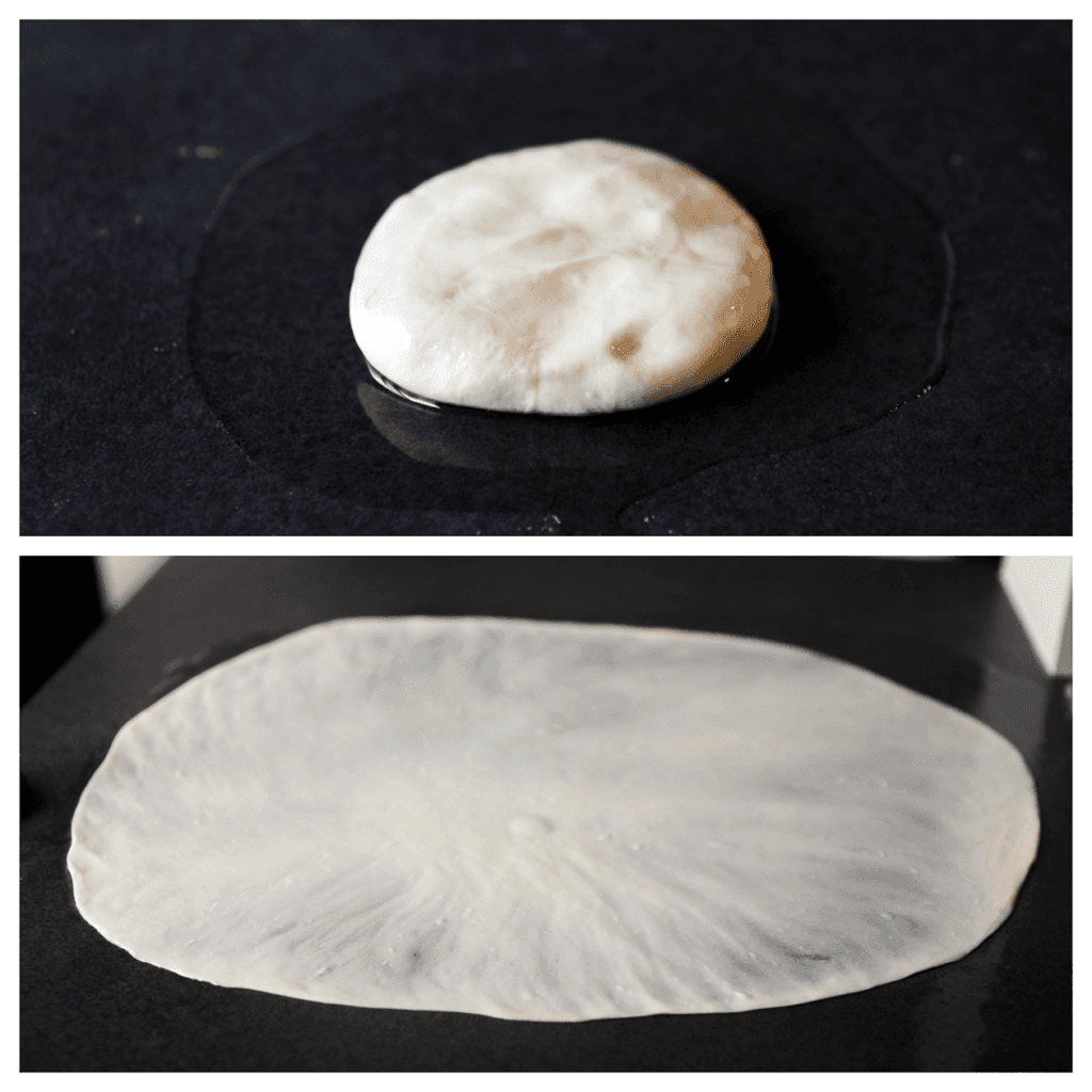 Vet de werkplek goed in met zonnebloemolie (15 ml). Leg het deeg erop. Met een lichte aanraking en een snelle vegende beweging met je vingertoppen, vanuit het midden naar buiten, verspreid je het deeg voorzichtig tot een flinterdunne gevormde cirkel van 45-50 cm. Vet je handen telkens goed in, zo vaak als nodig is. Dat doe je zodat je handen makkelijk over het deeg glijden.