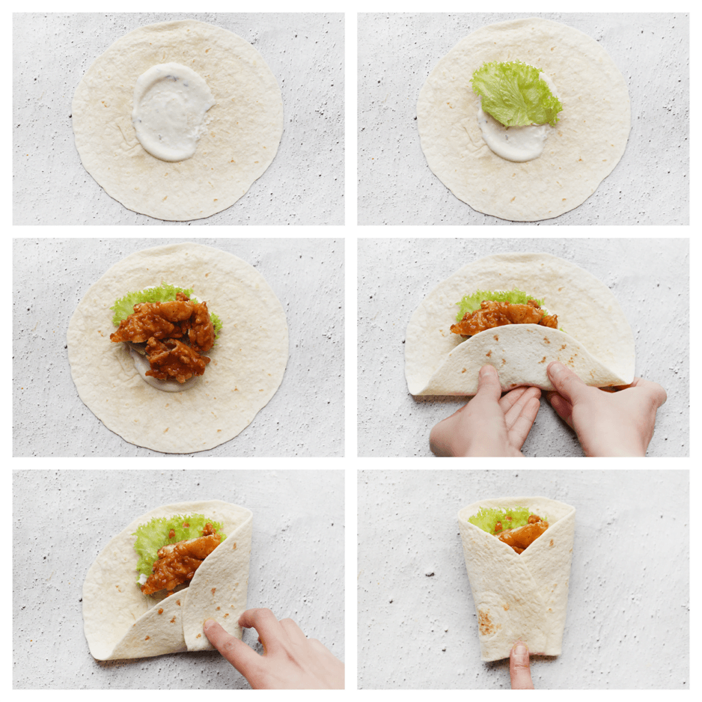 Maak de wraps vochtig. Neem een wrap en smeer in het midden een laagje saus. Leg er sla op gevolgd door de krokante kip. Als je van kaas houdt, kun je deze ook toevoegen bovenop de kip. Vouw de wrap dicht als een burrito.