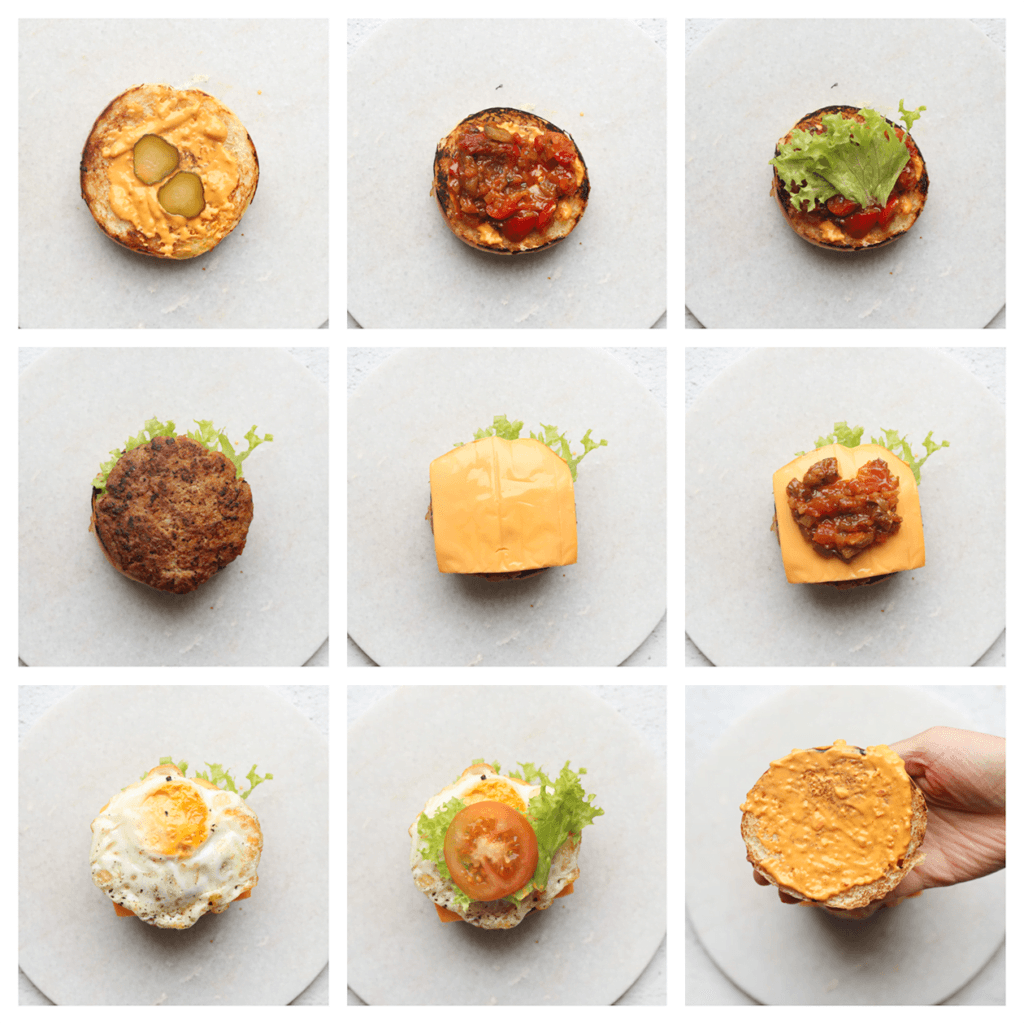 Neem een bolletje brood en snijd deze open. Je kunt het broodje nog even lichtjes aanbakken met wat boter voor meer smaak. Smeer er wat Andalouse saus op en leg er augurk op. Verdeel er wat charmilla over en leg er sla op. Leg de gehaktburger erop met een plakje cheddar kaas. Verdeel er weer een laagje charmilla over en leg er een gebakken ei op gevolgd door sla en tomaat. Neem de bovenkant van het broodje en smeer er wat andalouse saus op. Maak dicht.