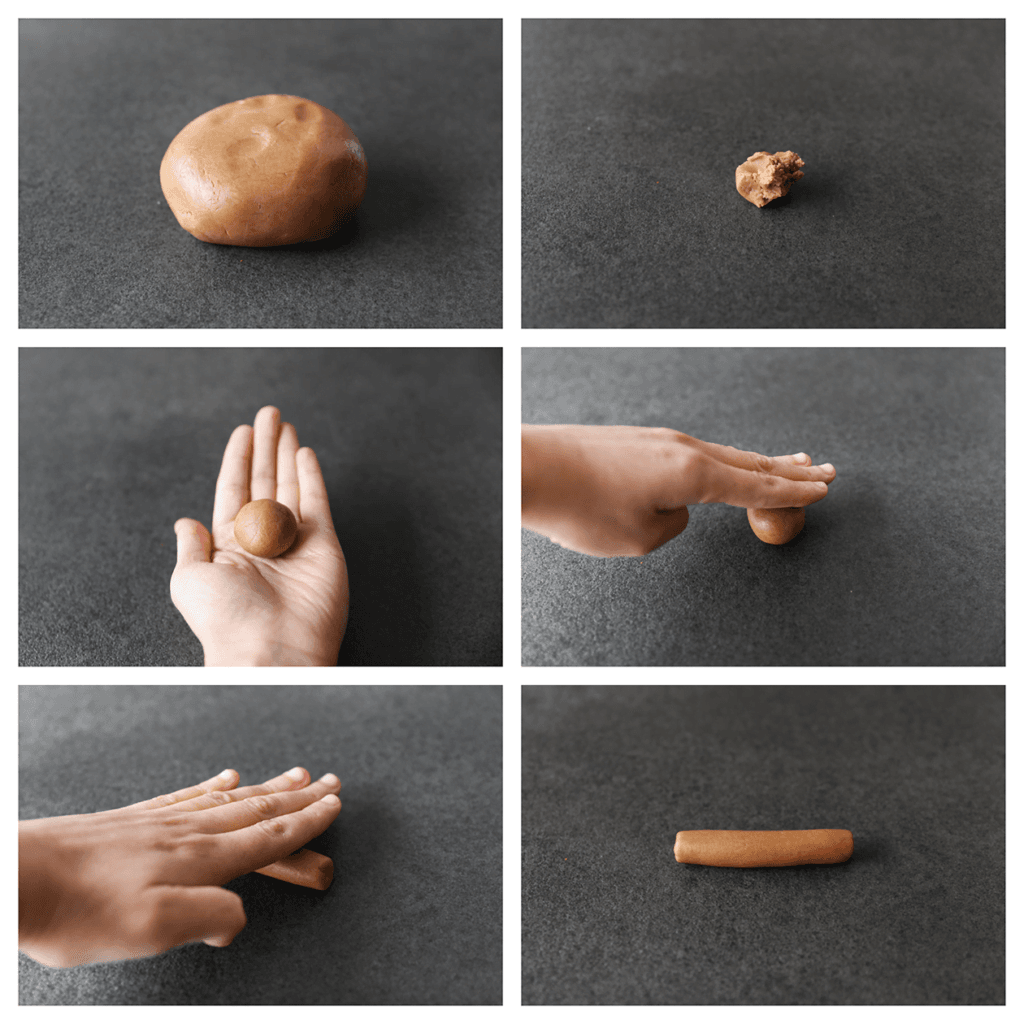 Neem een stuk van het deeg (20 gr) en vorm dit tot een bol. Rol de bol uit tot een staaf van 8 cm. Leg de choco-staafjes op een bakplaat met bakpapier.