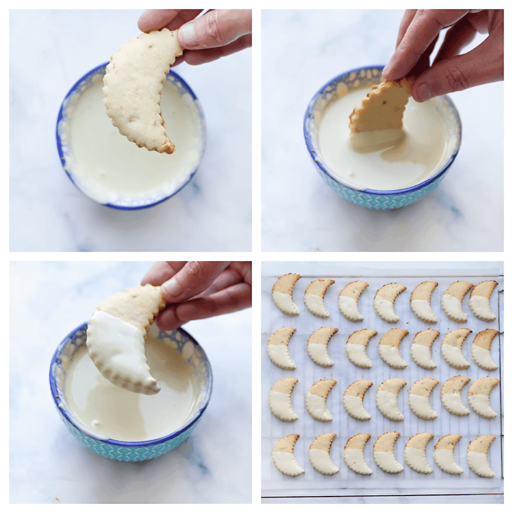 Smelt de witte chocolade au bain-marie en doe deze in een klein diep kommetje. Dip de pistache-citroenkoekjes voor de helft erin en leg ze op een vel bakpapier. Herhaal deze werkwijze. Doe de overgebleven witte chocolade in een spuitzak en maak er een kleine knip in.