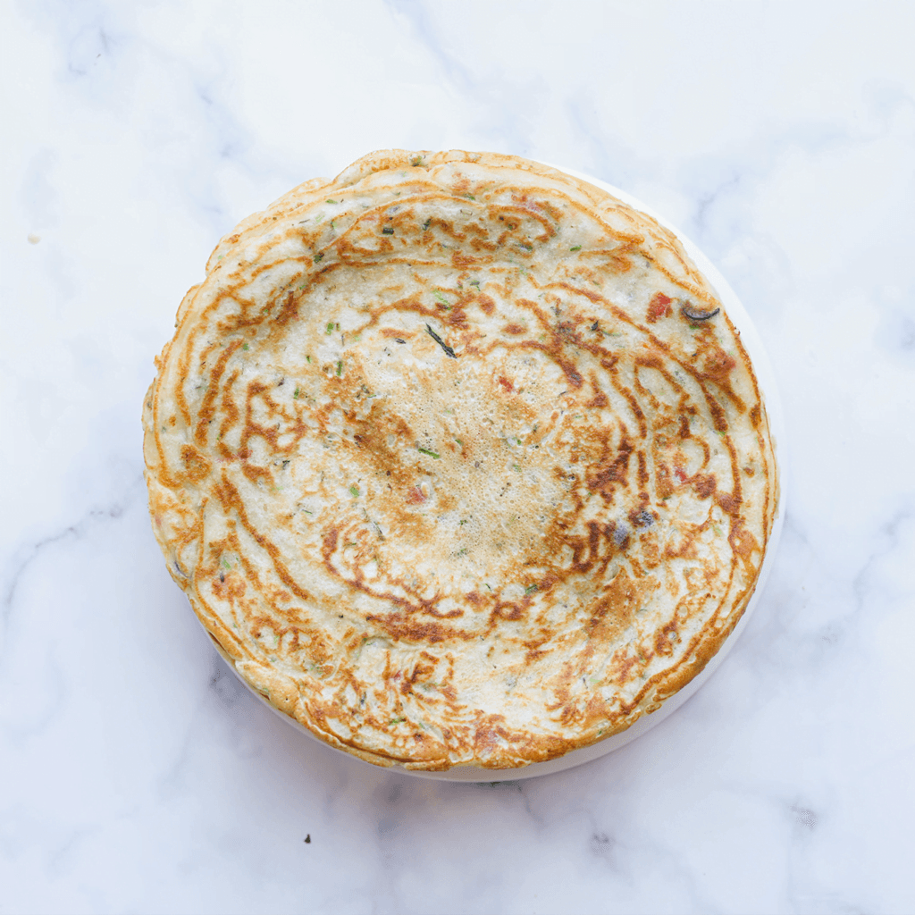 Dek de groentepannenkoeken af wanneer ze nog warm zijn.