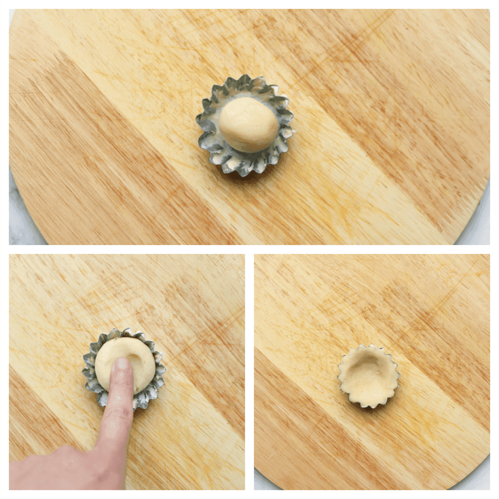 Vet de koekjesvorm in en druk het koekjesdeeg er goed in.