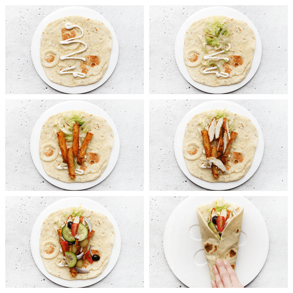 Neem een plat brood. Vul het brood met saus, sla, friet, kip en frisse groenten naar wens. Vouw het dicht en geniet ervan!