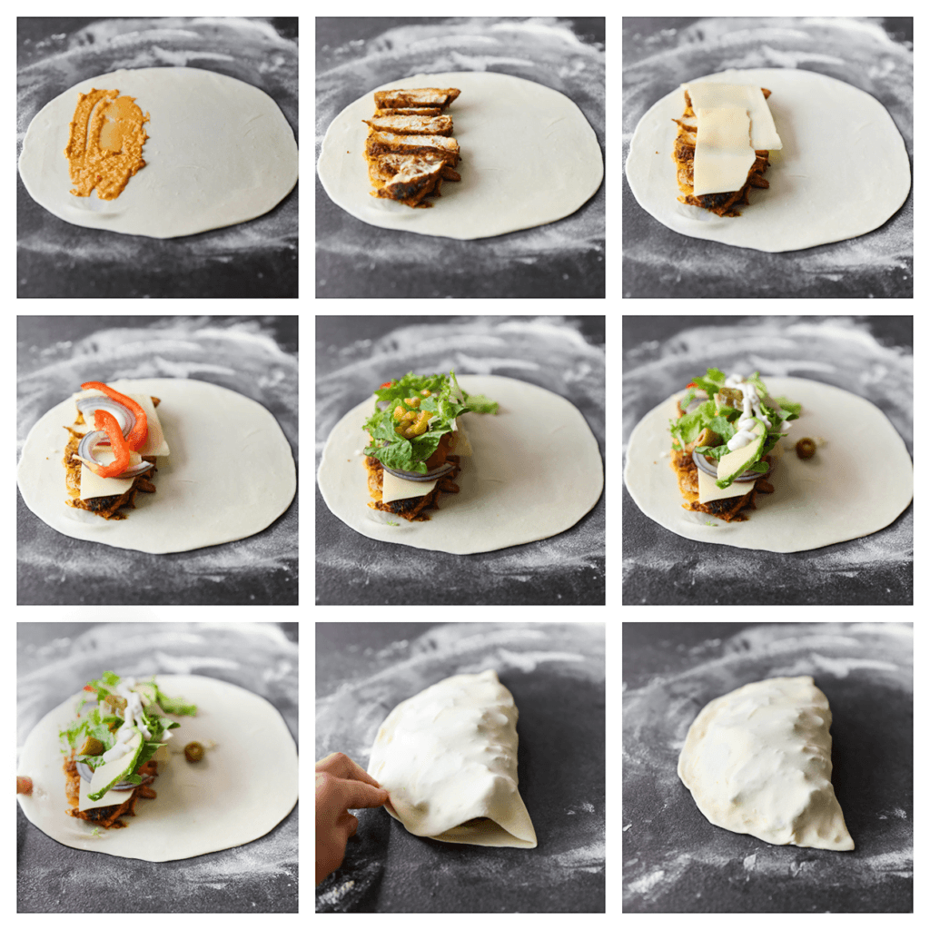 Stort het deeg op een met bloem bestoven werkplek. Rol het deeg uit tot een ronde, dunne lap van 25 cm. Vul achtereenvolgens met wat saus, het kipmengsel, kaas, rode ui, paprika, sla, maïs, olijven, jalapeno en avocado. Maak de randen vochtig met een beetje water en vouw het deeg goed dicht. Herhaal de werkwijze en leg de broodjes op een vel bakpapier.