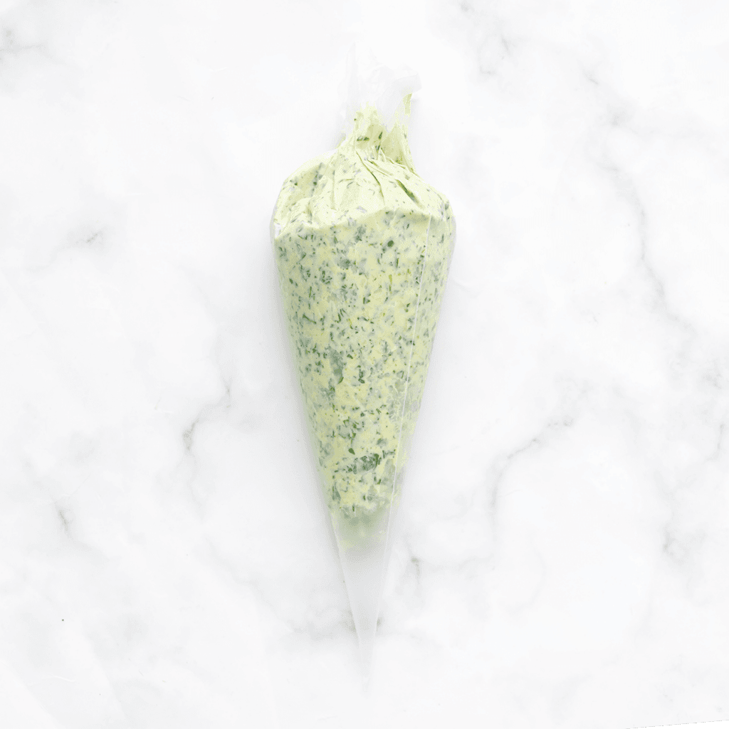 Doe het spinaziemengsel in een spuitzak.