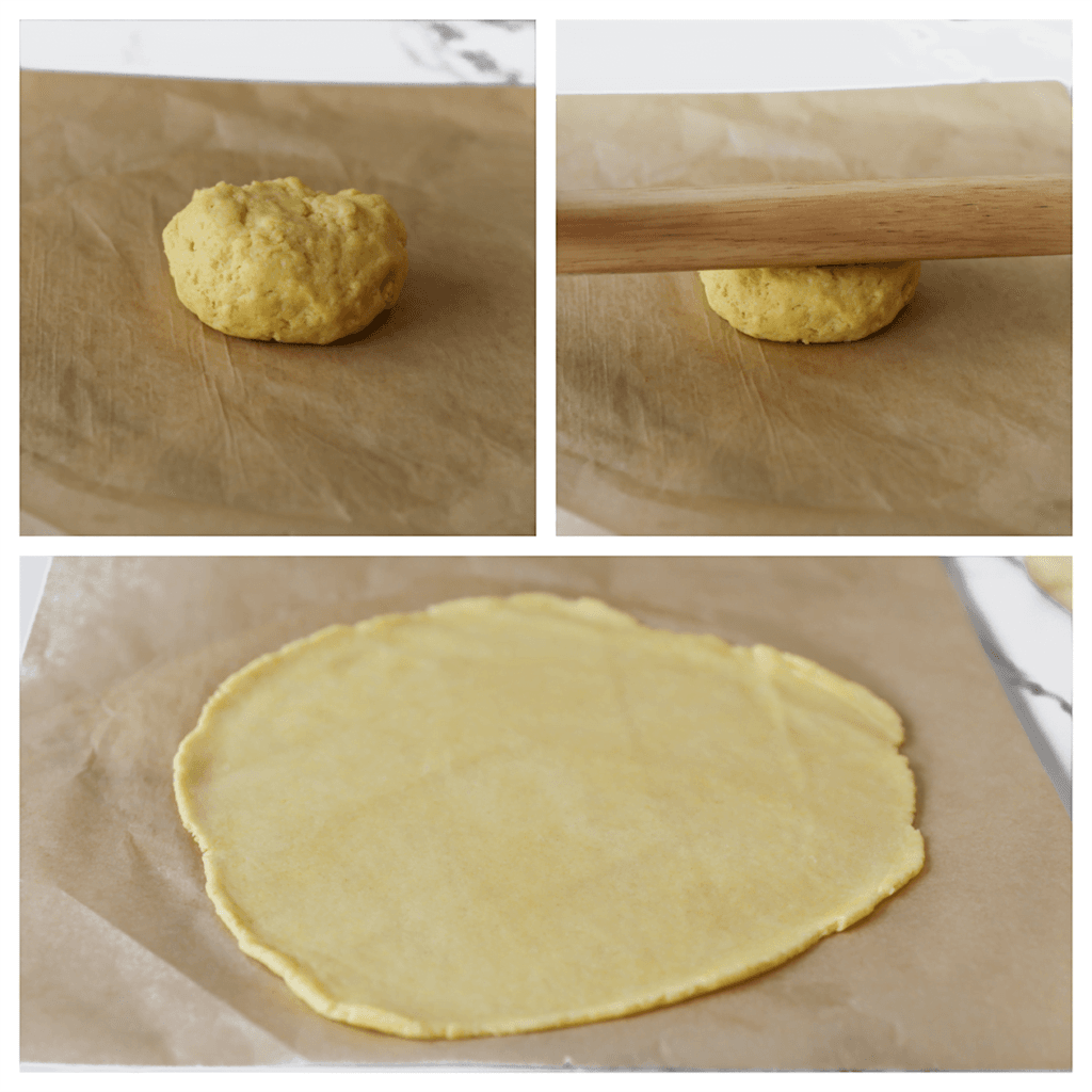 Neem een stuk deeg en leg dit op een vel bakpapier. Rol het uit tot een platte lap.