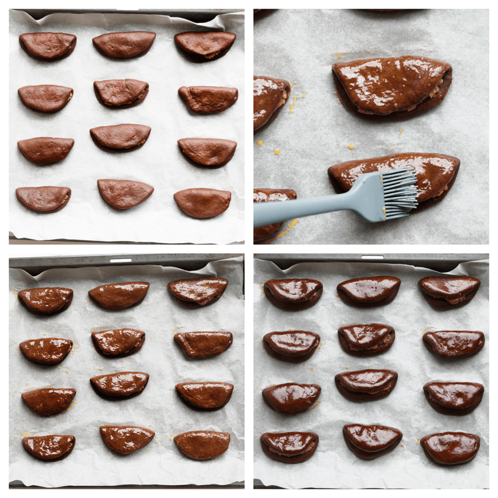 Leg de chocolade-pecanbroodjes op een bakplaat met bakpapier. Bestrijk ze met het geklutste ei. Laat de chocolade-pecanbroodjes 30 minuten rijzen of tot ze in formaat zijn verdubbeld.