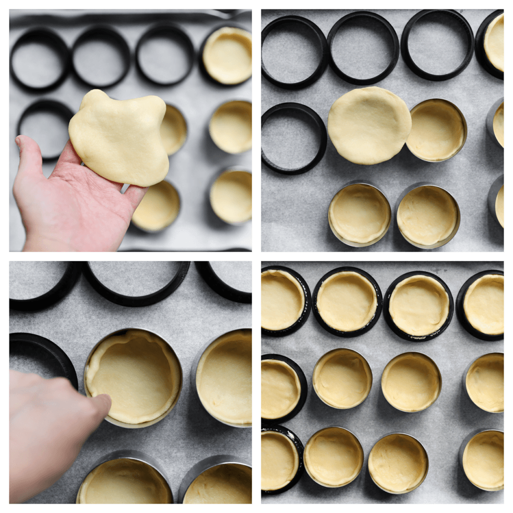 Leg wat uitsteekvormpjes op een bakplaat, bedekt met bakpapier. Plaats het platgerolde deeg in een bakring en druk het stevig aan, waarbij je de zijkanten mooi vormgeeft. Herhaal deze stap voor alle bolletjes deeg.