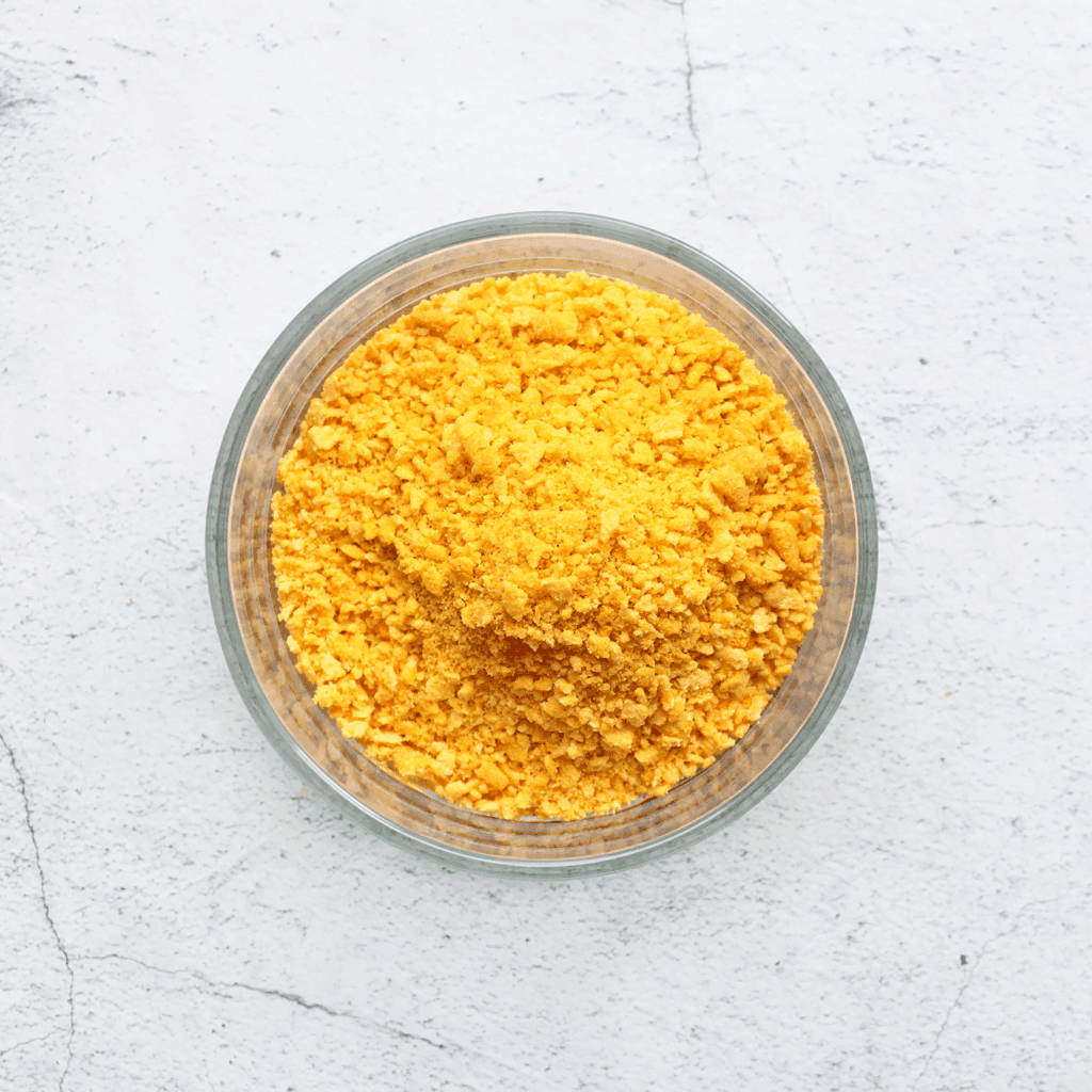 Verkruimel de Bugles goed in kleine stukken.