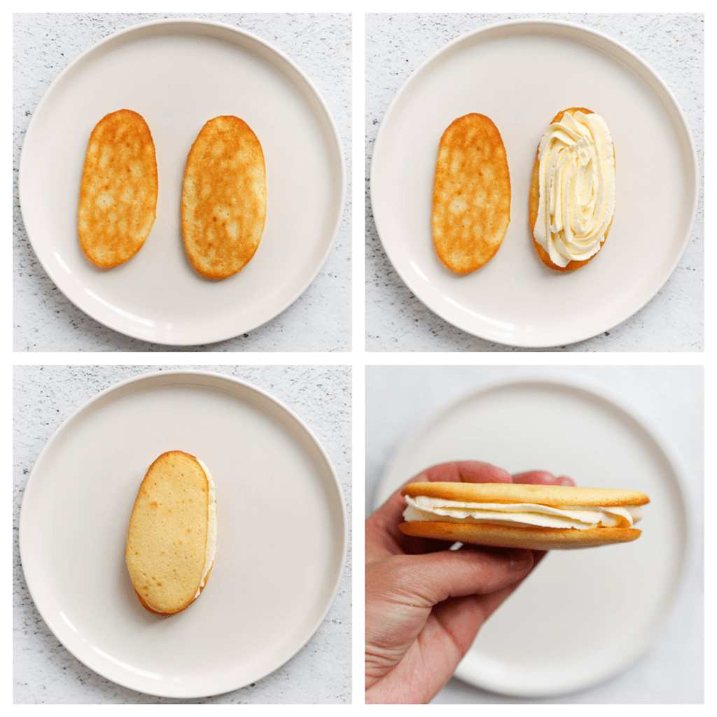 Neem een cakeje en spuit er wat room op. Neem een ander cakeje en leg deze er bovenop. Druk ze lichtjes tegen elkaar aan. Herhaal deze werkwijze.