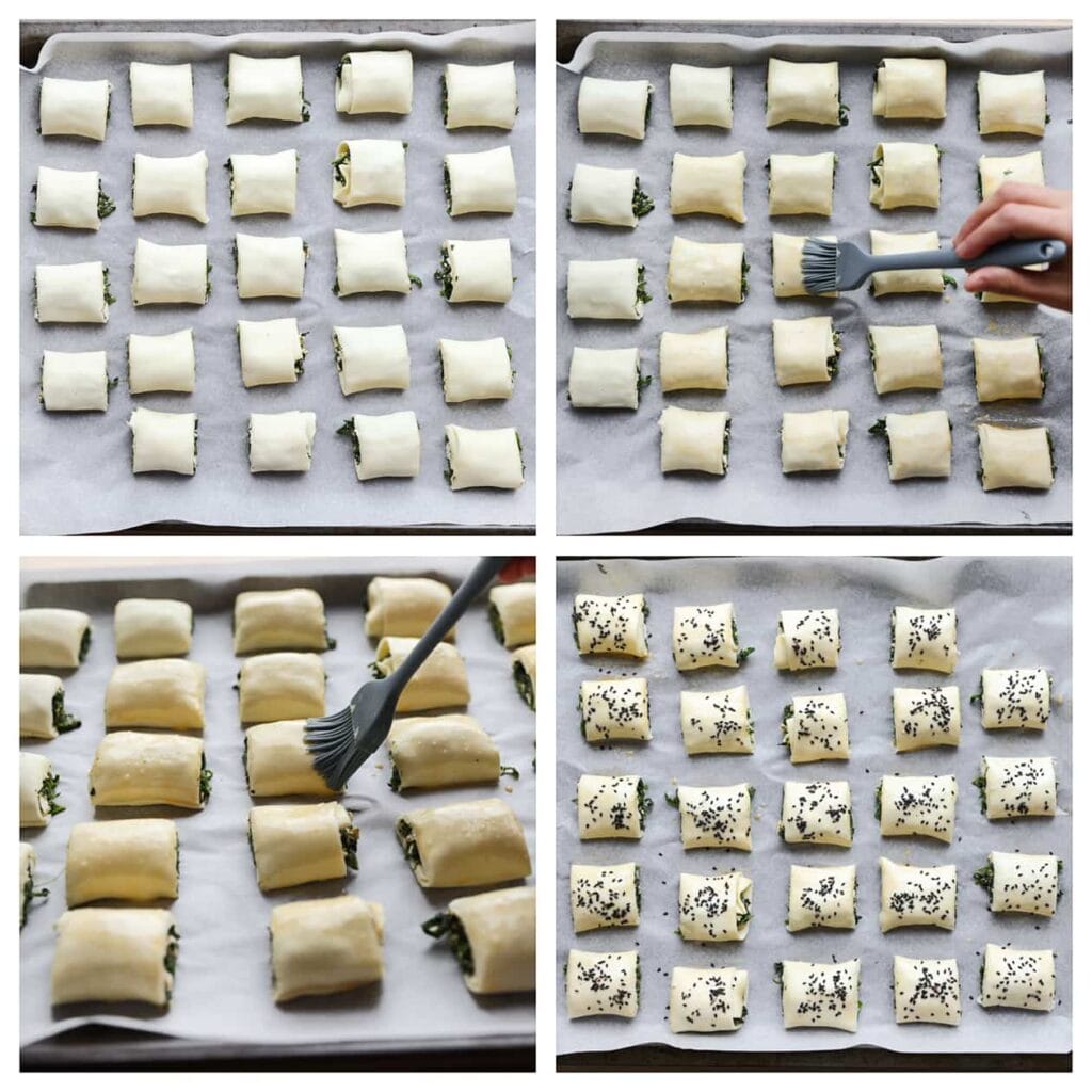 Plaats de bladerdeeghapjes met spinazie en feta op een bakplaat met bakpapier. Bestrijk ze met een geklutst ei en garneer ze met sesamzaadjes.