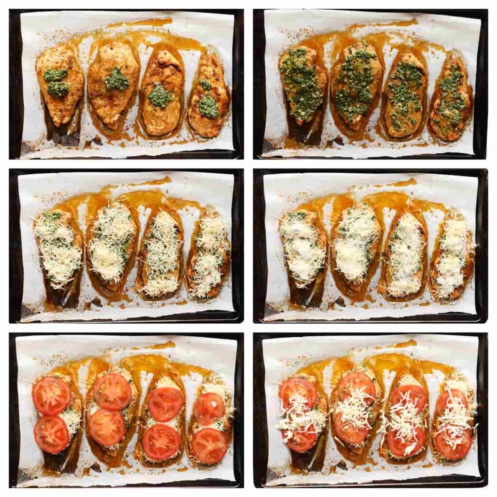 Haal de kip voorzichtig uit de oven. Smeer de kip in met een laagje groene pesto en verdeel er geraspte kaas, mozzarella, plakjes tomaat en nog wat geraspte kaas over.