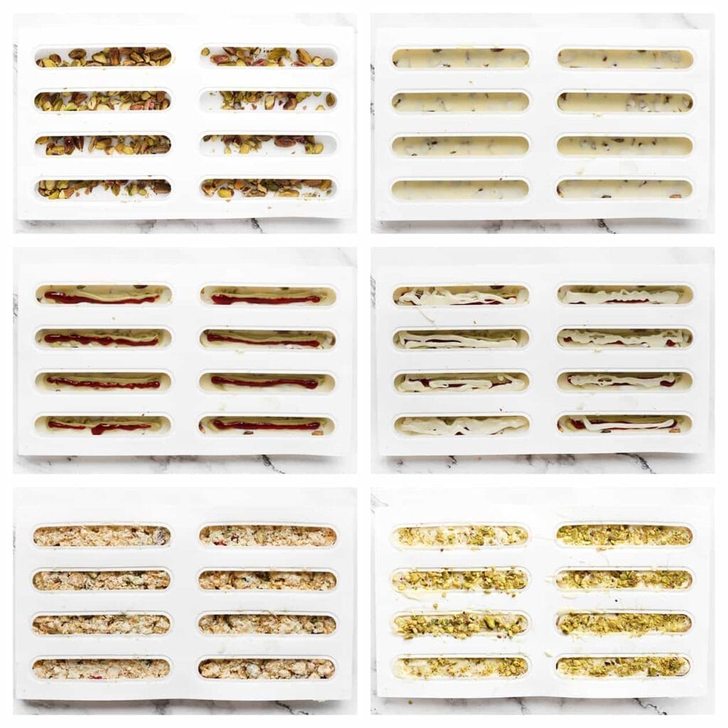 Neem een siliconenvorm. Verdeel een laagje gehakte pistachenoten over de bodem en bedek deze met een laagje gesmolten witte chocolade. Spuit er vervolgens een lijntje pistachepasta, frambozenjam en witte chocolade overheen. Schep er wat van het cornflakesmengsel op en bedek dit met een laagje witte chocolade. Strooi nog wat gehakte pistachenoten eroverheen. Zet de siliconenvorm 60 minuten in de vriezer, of totdat de chocolade volledig hard is.