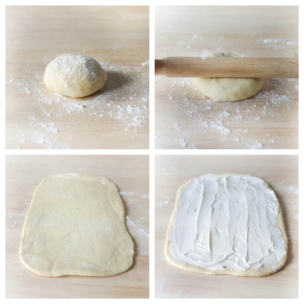 Bestuif je werkplek met bloem en rol een deel van het deeg uit tot een rechthoek. Smeer de helft van de smeerkaas over het deeg. Herhaal de werkwijze.