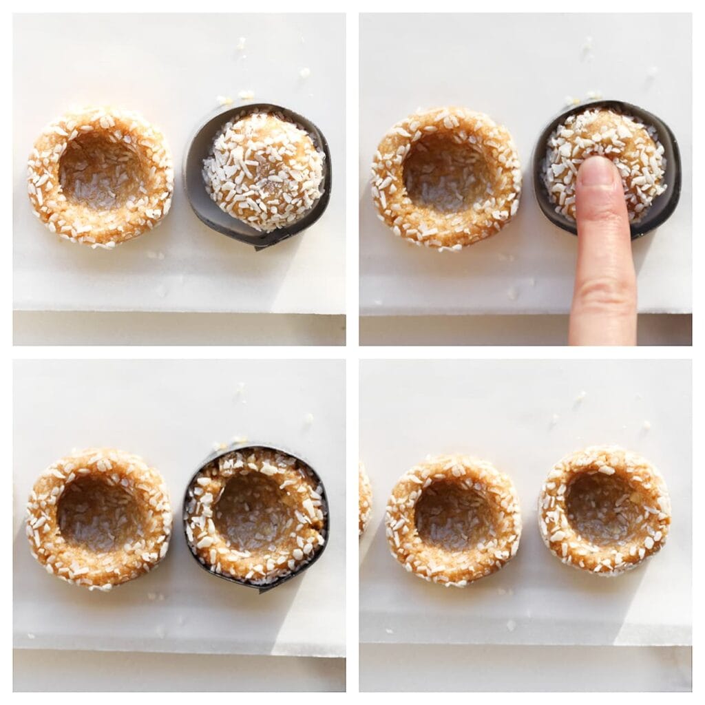 Plaats de koekjesbollen op een vel bakpapier. Gebruik een bakring of koekjesuitsteker (Ø 4 cm) om bovenop een bolletje te plaatsen. Druk met de achterkant van een houten lepel, je vinger of een ander voorwerp voorzichtig een ondiep gat in het midden. Herhaal voor alle bolletjes.