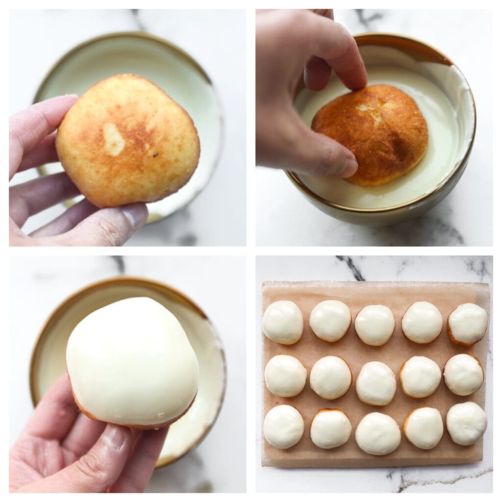 Dip alleen de bovenkant van de donuts in de gesmolten chocolade en leg ze terug op bakpapier.