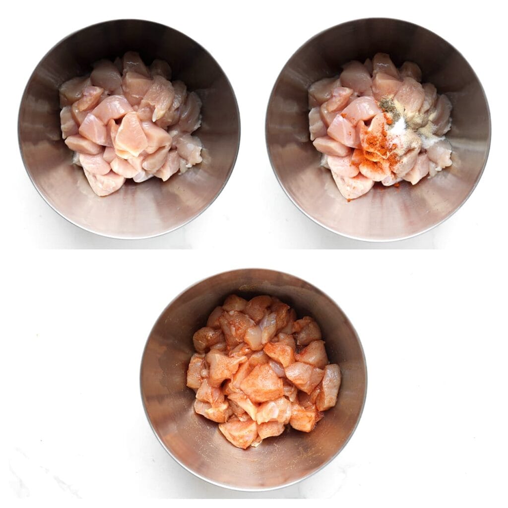 Snijd de kippendijen in stukjes en doe ze in een kom. Voeg het zout, de zwarte peper, knoflookpoeder, uienpoeder, cayennepeper en olijfolie toe. Meng goed zodat alle stukjes kip bedekt zijn met de kruiden.