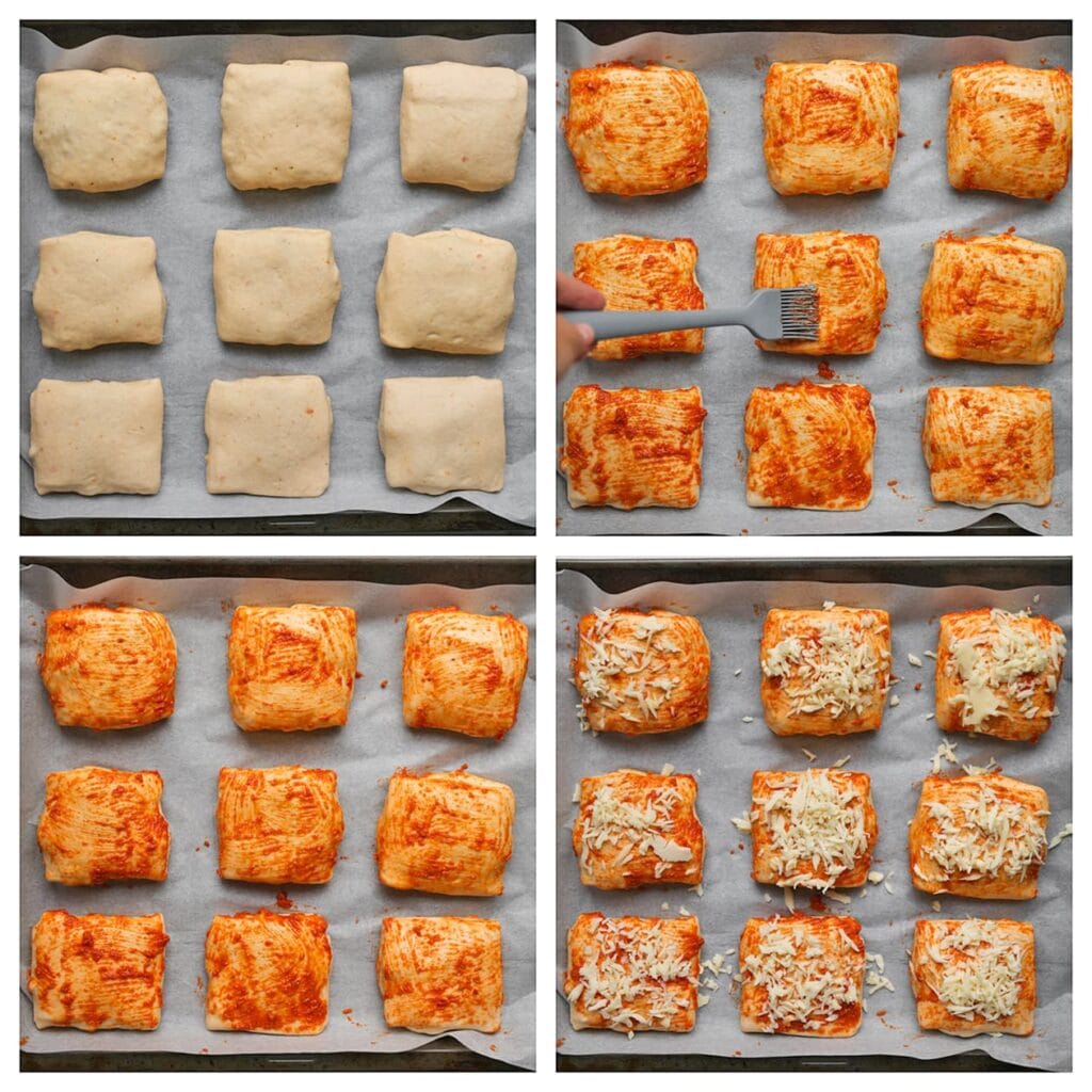 Leg het deeg op een met bakpapier beklede bakplaat. Bestrijk met rode pesto en bestrooi met geraspte kaas. Laat ze afgedekt rusten tot ze luchtiger en groter zijn.